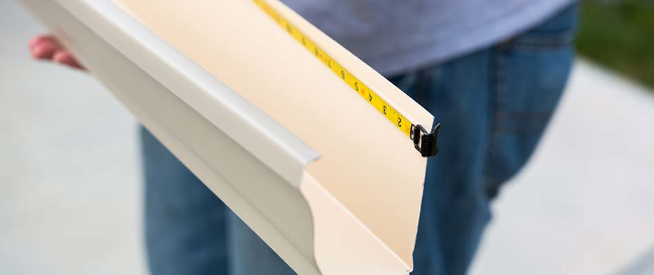 Measuring custom gutters for a property in Wesley Chapel, FL.