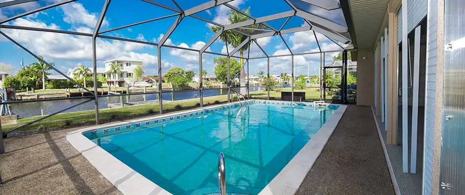 Pool with an aluminum screen cage installation in Zephyrhills, FL.