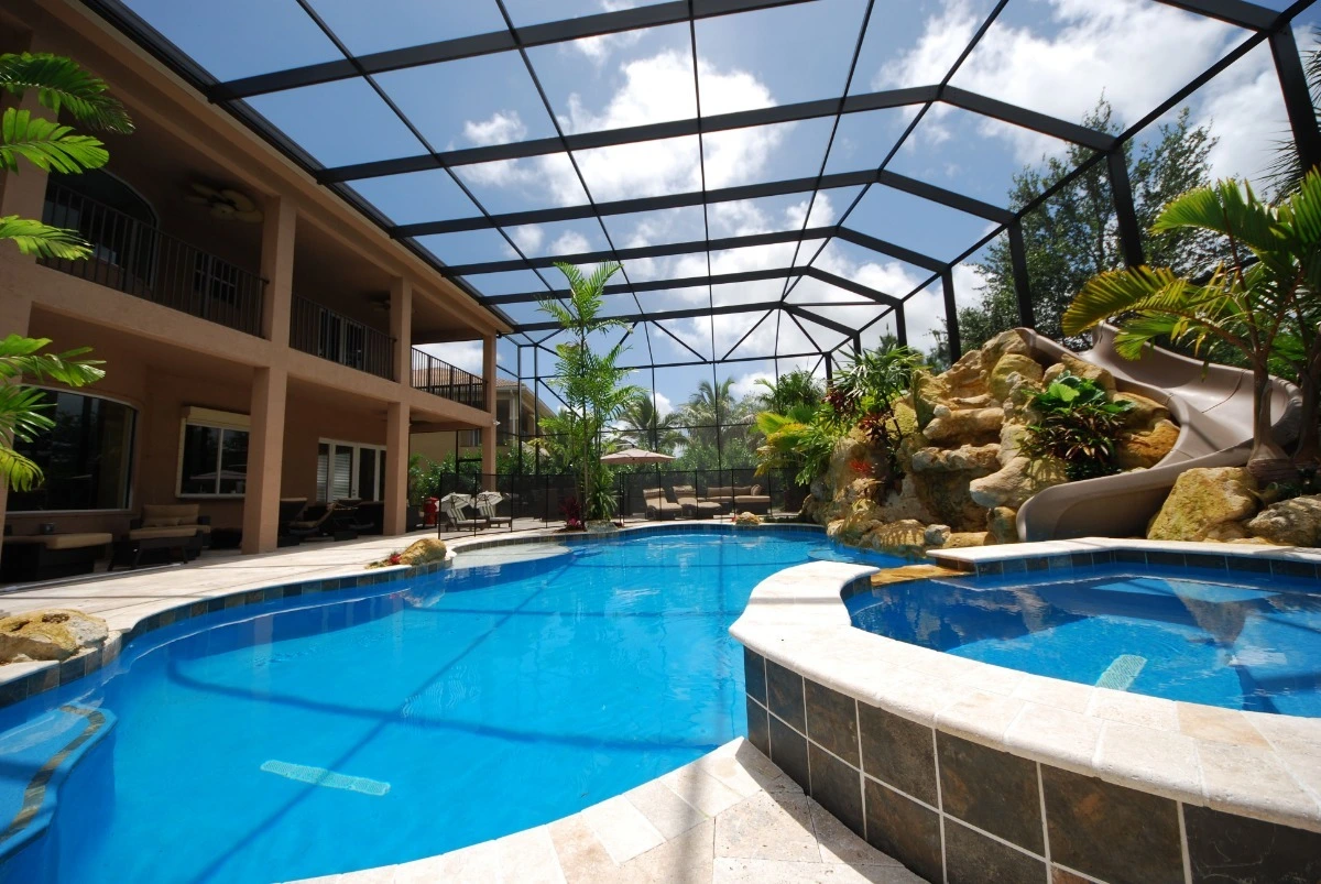 Aluminum pool cage construction with screen panels in Lakeland, FL.