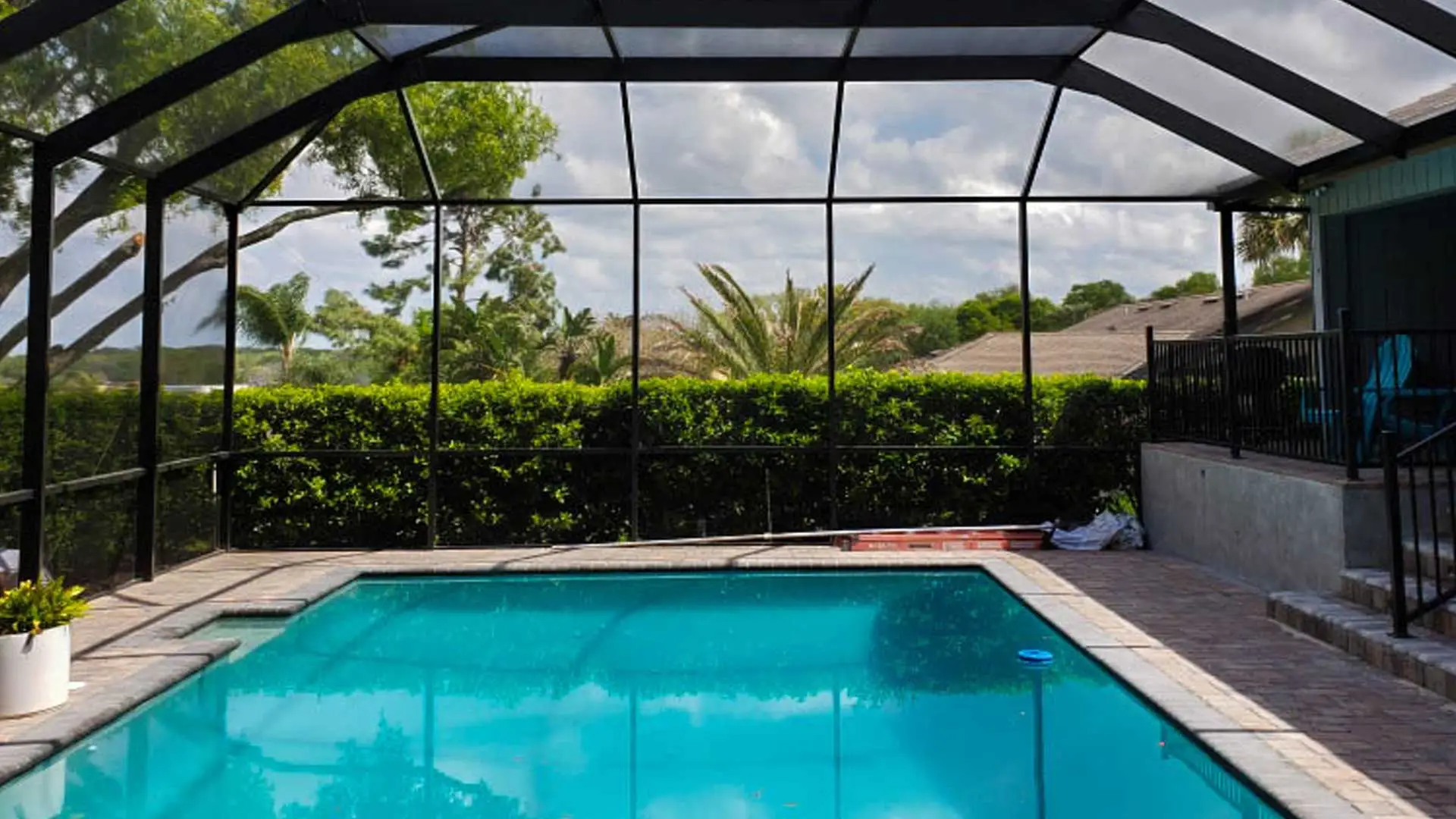 A new aluminum pool cage in the backyard of a property in Plant City, FL.