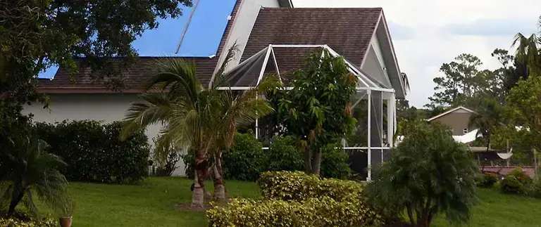 Wind damage on a Florida lanai and screen enclosure