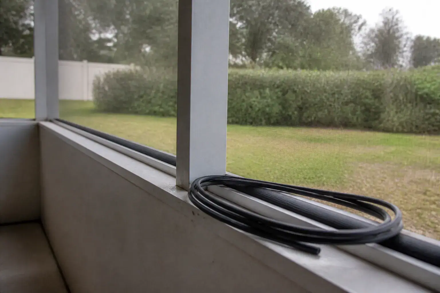 Lanai screen repair in Lakeland, FL: spline seated in the aluminum channel