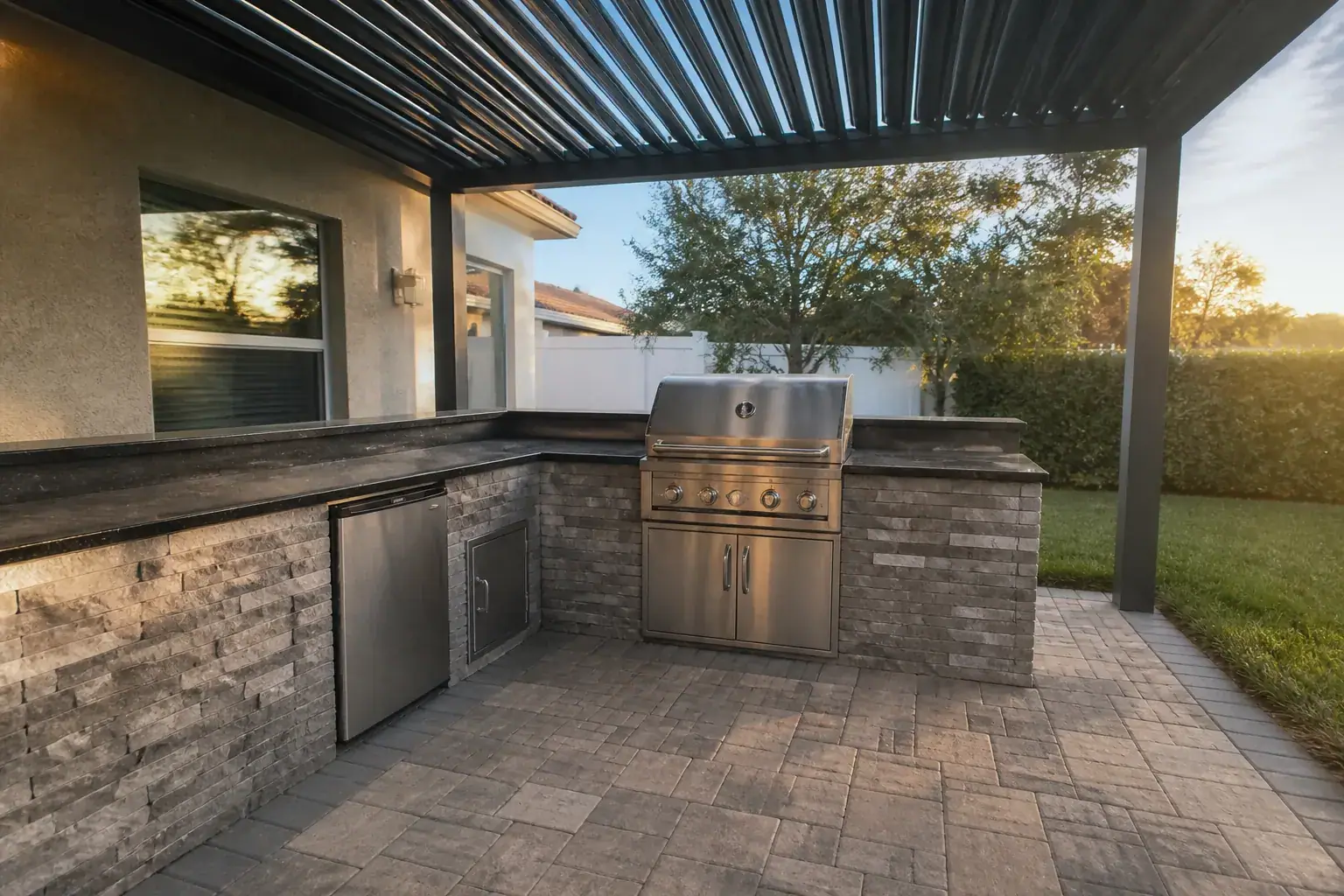 Outdoor kitchen in Lakeland, FL under a louvered patio cover