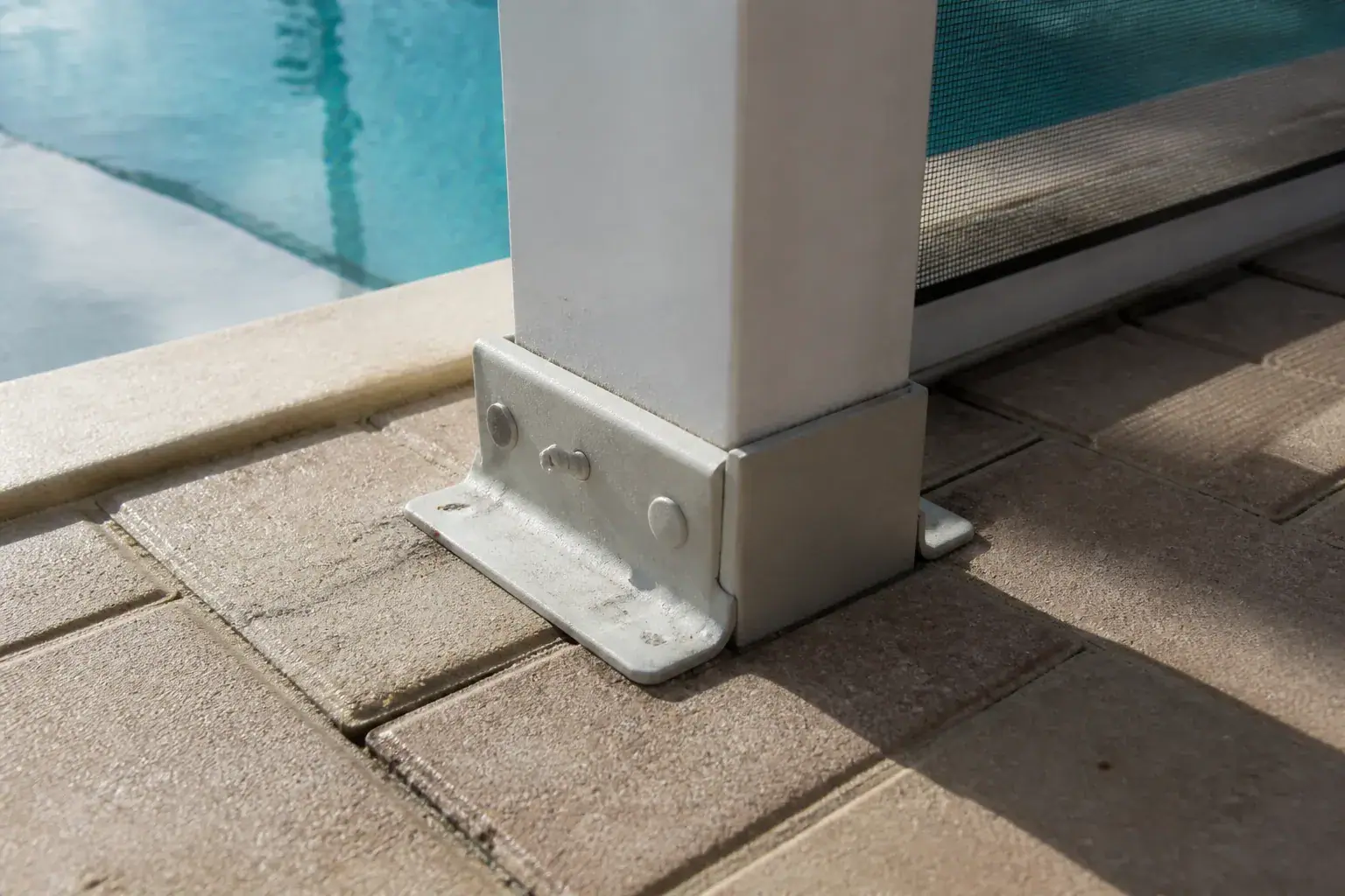 Pool cage cost in Lakeland, FL: aluminum post anchored into a paver deck