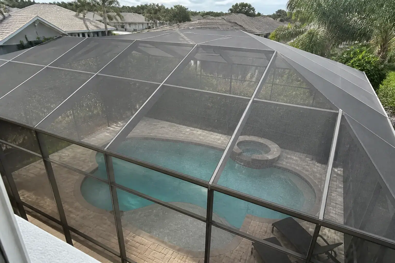 Pool cage covering a Florida backyard pool in Lakeland
