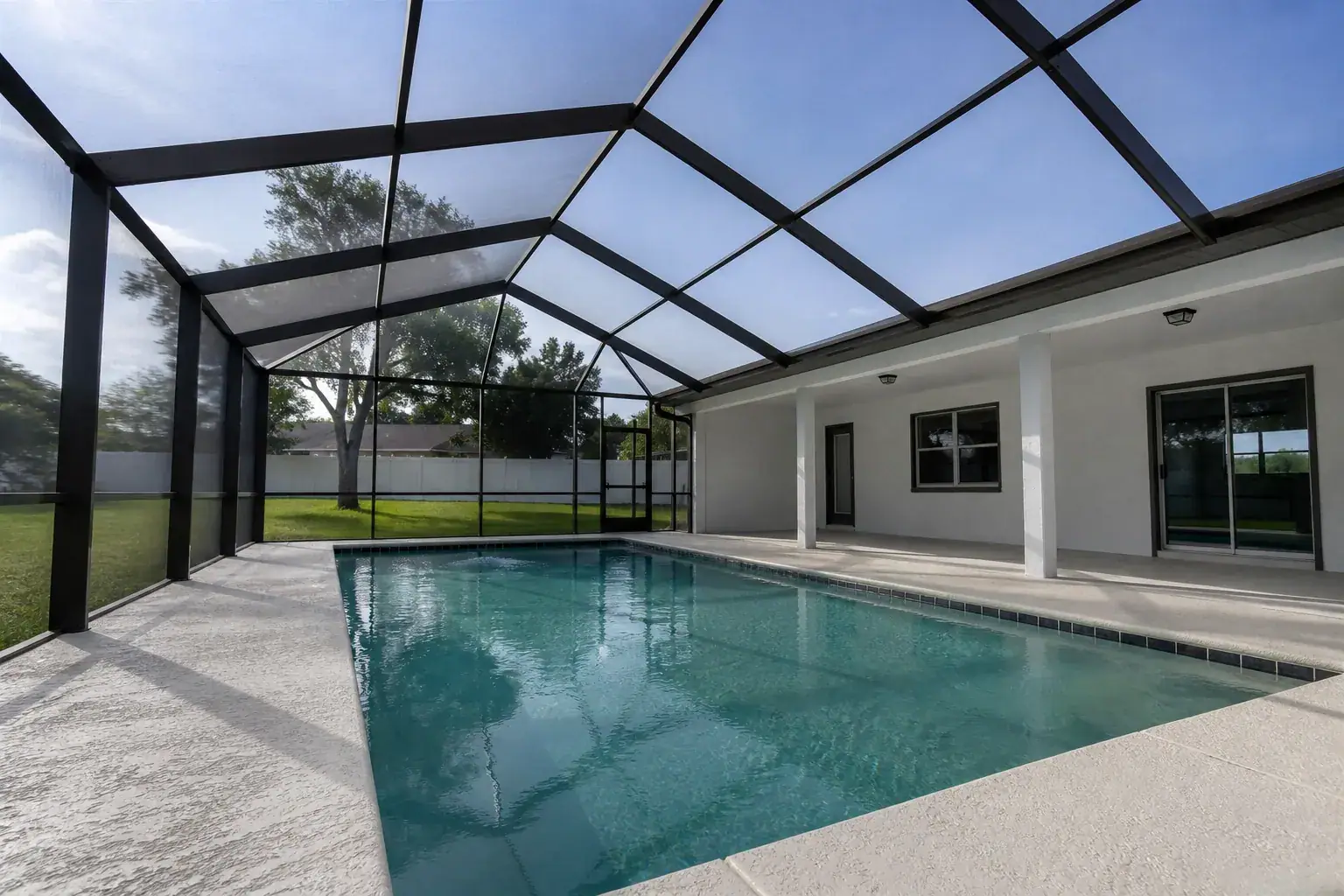 Pool cage in Lakeland, FL over a backyard pool, True Aluminum