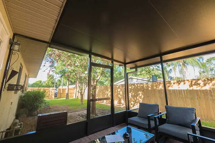 Inside the new Lakeland screen room looking out at the backyard