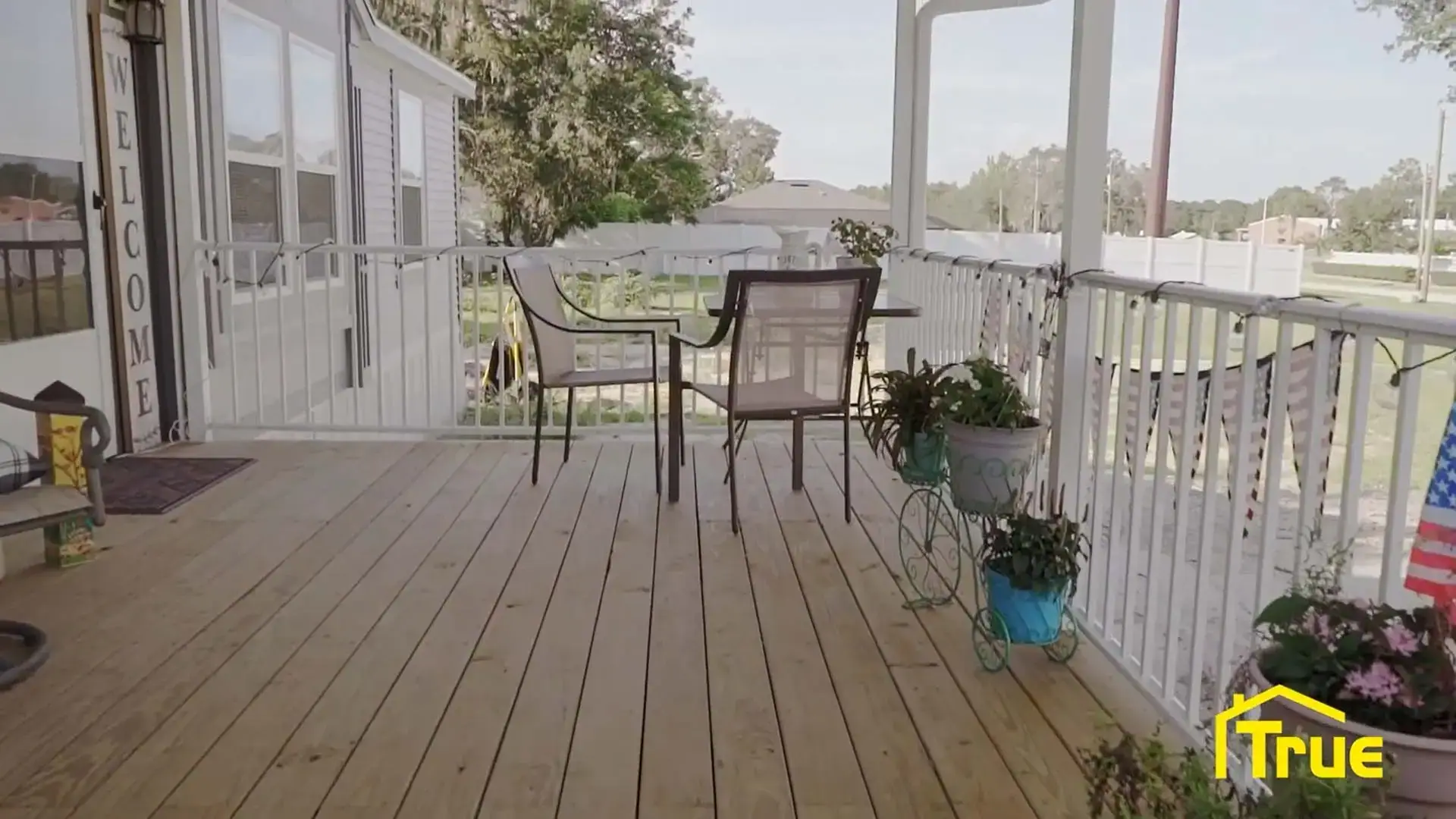 Custom covered front patio and porch built by True Aluminum