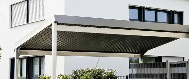 Covered aluminum carport protecting a vehicle at a Central Florida home