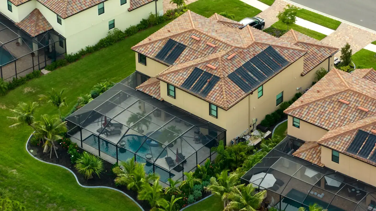 Aluminum pool cage over a backyard swimming pool at a Lakeland, FL home
