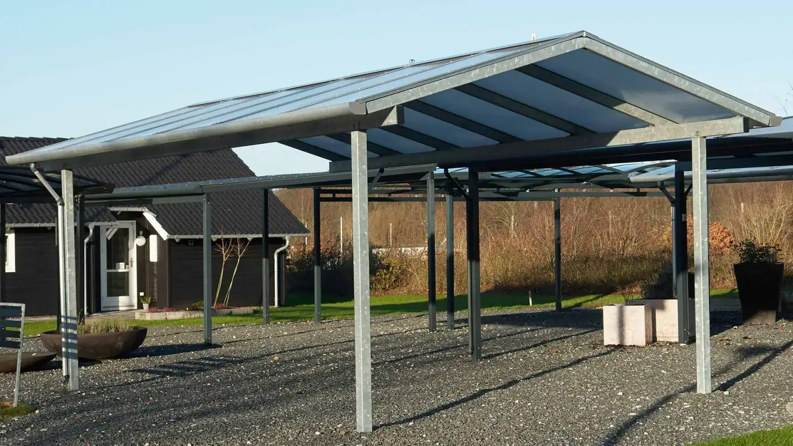 Aluminum carport protecting vehicles at a Florida home