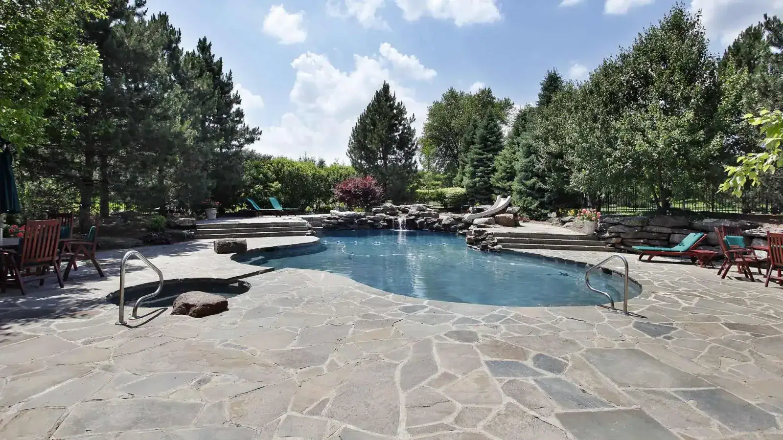 Pool deck with natural stone pavers
